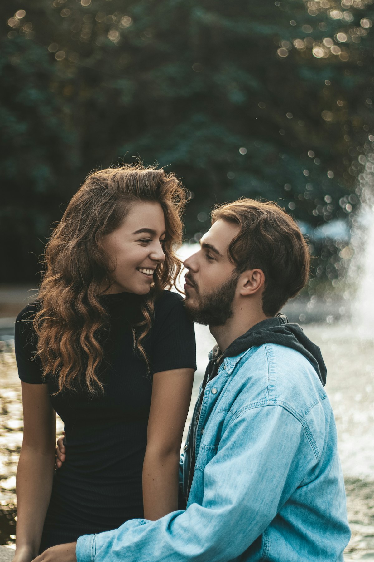 Two adults sharing a warm, affectionate kiss