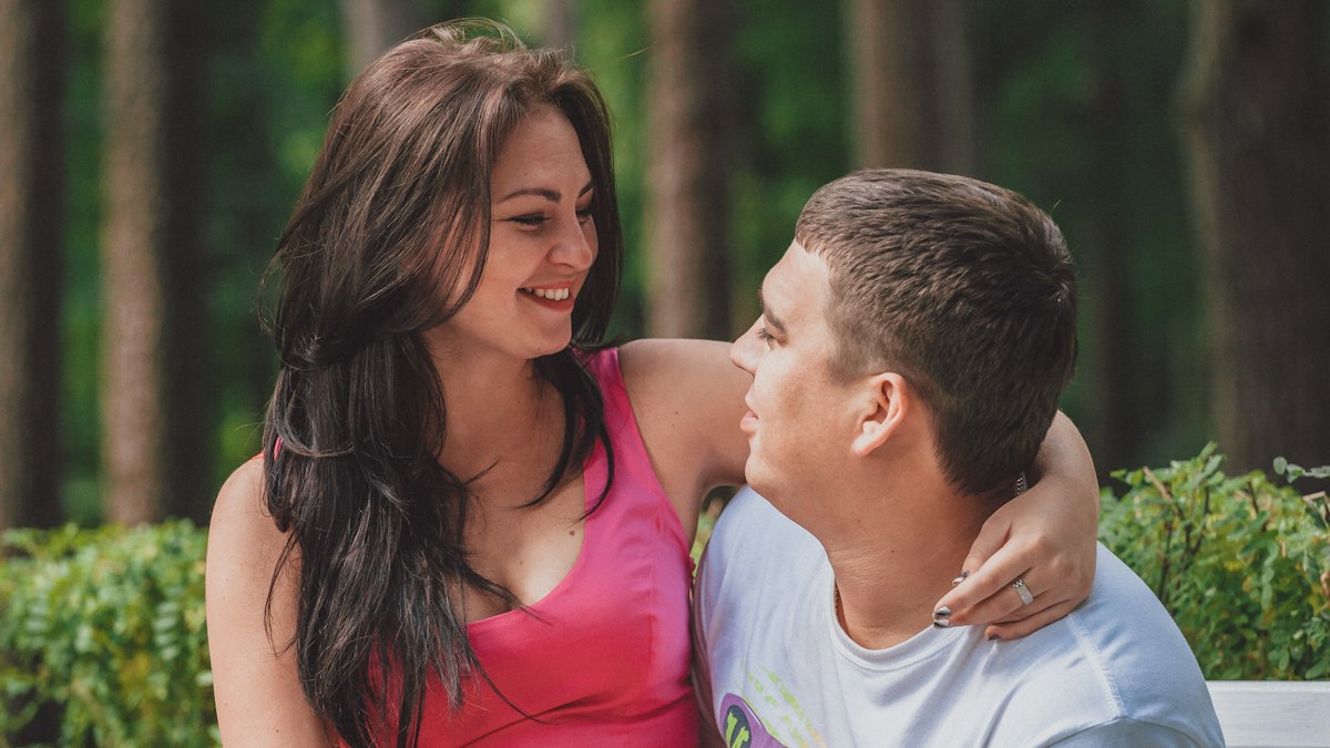 A man and a woman sharing a tender kiss, close together