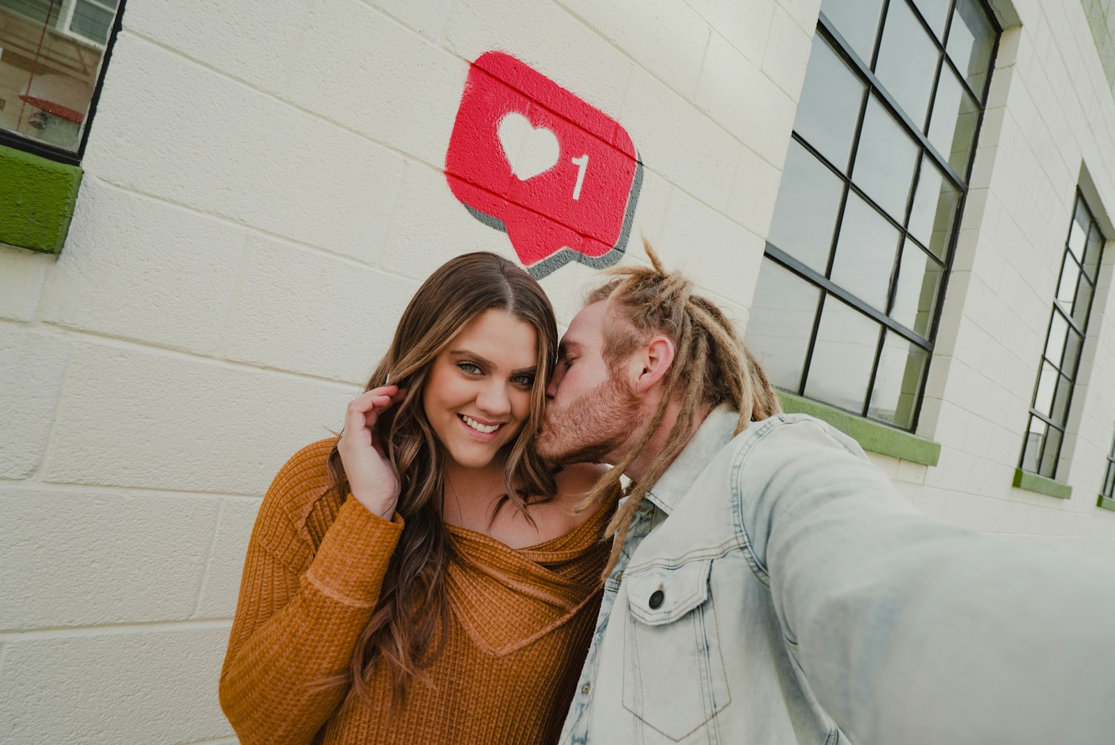 Two adults smiling together during a warm conversation